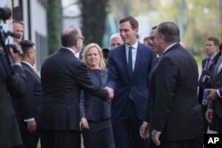 Homeland Security Secretary Kirstjen Nielsen, from center left, White House Senior Adviser Jared Kushner, Treasury Secretary Steven Mnuchin and Secretary of State Mike Pompeo, are received at Los Pinos presidential residence by Carlos Sada Solana, Mexico's undersecretary for North America, in Mexico City, July 13, 2018.