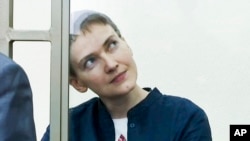 FILE - Nadezhda Savchenko sits in a glass cage in a town of Donetsk, Rostov-on-Don region, March 21, 2016. 