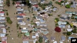 The streets of the North Island town of Edgecumbe in New Zealand, flooded, April 6, 2017, after heavy rain from the remnants of Cyclone Debbie. About 2,000 residents were rescued. 