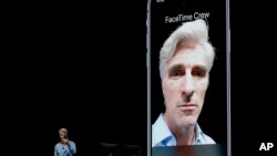 Craig Federighi, Apple's senior vice president of Software Engineering, speaks about group FaceTime during an announcement of new products at the Apple Worldwide Developers Conference Monday, June 4, 2018, in San Jose, Calif. (AP Photo/Marcio Jose…