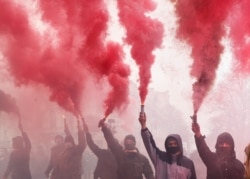 Supporters of Serhiy Sternenko, a Ukrainian civil rights activist and former leader of the far-right radical group Right Sector, hold a rally outside presidential administration headquarters in Odesa, February 27, 2021.