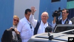 In this photo provided by the Andina News Agency, former Peruvian President Pedro Pablo Kuczynski waves as he leaves a medical branch of the prosecutor’s office, in Lima, Peru, April 10, 2019.