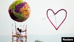 A couple in Thailand shoot an arrow through a heart on their wedding day. Unfortunately, many migrant brides in South Korea don't have such happy marriages.