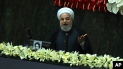 Iranian President Hassan Rouhani speaks during the inauguration of the new parliament in Tehran, Iran, Wednesday, May, 27, 2020. 