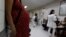 FILE - Pregnant woman waits for a routine general checkup, which includes Zika screening, at the maternity ward of the Hospital Escuela in Tegucigalpa, Honduras, Jan. 27, 2016. 