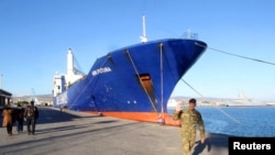 One of two cargo ships intended to take part in a Danish-Norwegian mission to transport chemical agents out of Syria docks in Limassol, Dec. 14, 2013. 