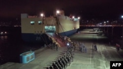 This screen grab taken from video released on August 29, 2019 from China's state-run CCTV shows People's Liberation Army (PLA) troops for the Hong Kong Garrison arriving on a ship in Hong Kong during a routine rotation of personnel. China's military…