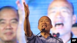 FILE - Nationalist Party's Han Kuo-yu reacts after winning the mayoral election in Kaohsiung, Taiwan, Nov. 24, 2018.