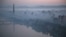 Dawn breaks over Pyongyang, North Korea, as buildings poke through the midst and the Juche Tower, left, stands by the Taedong riverbank, Oct. 13, 2015.
