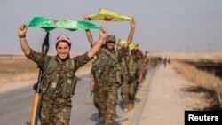 تصویری از چند جنگجوی کُرد سوریه‌ای. آرشیو