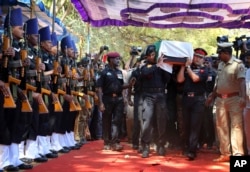 The body of India's National Security Guard commando, Niranjan Kumar, is carried by Indian soldiers as they pay their last respects in Bangalore, Jan. 4, 2016.