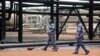 Sudanese armed forces walk inside oil production facility at border town of Heglig, Sudan (file photo)