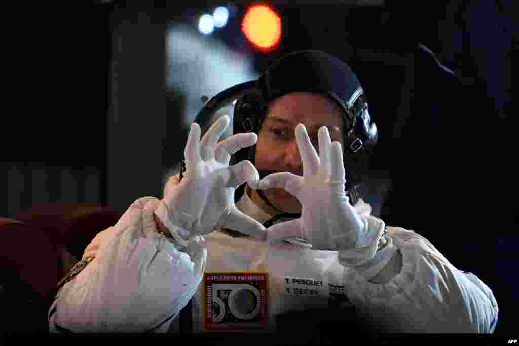 Member of the main crew of the 50/51 expedition to the International Space Station (ISS), France&#39;s astronaut Thomas Pesquet makes a heart with his hands at the Russian-leased Baikonur cosmodrome in Baikonur.
