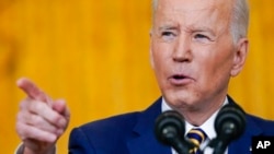 President Joe Biden speaks during a news conference in the East Room of the White House in Washington, Jan. 19, 2022. 