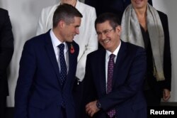 Britain's Secretary of State for Defense Gavin Williamson reacts with Turkey's Defense Minister Nurettin Canikli during a NATO defense ministers meeting at the alliance's headquarters in Brussels, Belgium, Nov. 8, 2017.