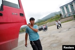 FILE - A Chinese truck driver arrives at customs at the border between China and North Korea near Hunchun, Jilin province. There have been reports of expanded economic development at the China, North Korea border.