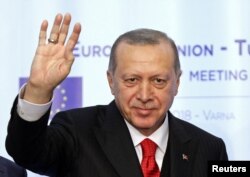 FILE - Turkish President Tayyip Erdogan waves during a news conference at Euxinograd residence, near Varna, Bulgaria, March 26, 2018.