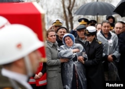 Mother of Koray Karaca, a Turkish soldier who was killed during the operation in Syria's Afrin region, mourns his death during a funeral ceremony in Istanbul, Feb. 11, 2018.