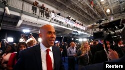 Senator Cory Booker works his way through the spin room after the 2020 Democratic U.S. presidential debate in Houston, Sept. 12, 2019. 
