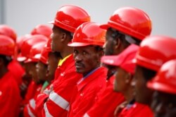 FILE - Workers stand at the Gibe III hydroelectric dam during its inauguration in Shoma Yero village in Southern Nations, Nationalities, and Peoples' Region in Ethiopia, Dec. 17, 2016.