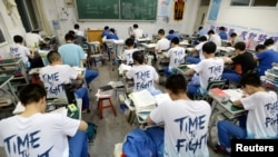 FILE - Students study in the evening ahead of the annual national college entrance examination, or "gaokao," at a high school in Handan, Hebei province, China, May 23, 2018.