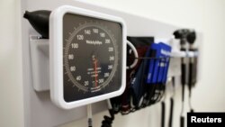 FILE - Medical equipment on the wall of an examination room in San Diego, Calif., Nov. 17, 2014.