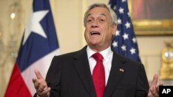 FILE - Sebastian Pinera speaks during an appearance with Secretary of State John Kerry at the State Department in Washington, June 3, 2013. 