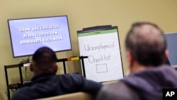 FILE - Jobless workers are seen attending an employment orientation class at the Georgia Department of Labor office in Atlanta, March 17, 2016. The U.S. Labor Department reported Thursday that initial claims for unemployment jumped by 17,000 during the week ending April 30. 