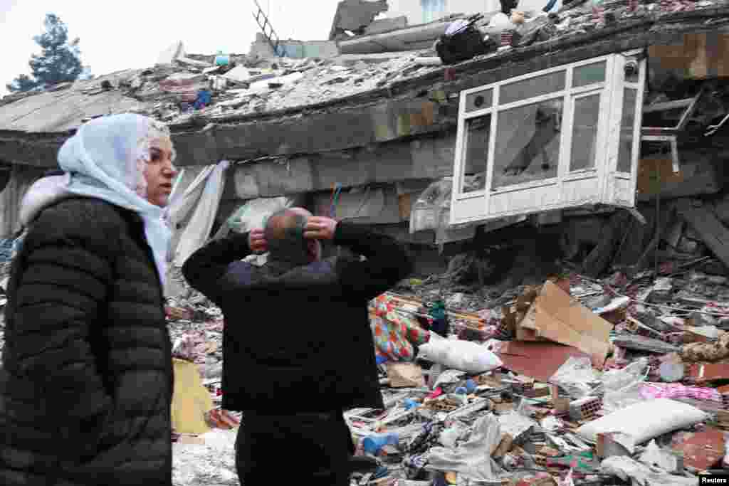 People search for survivors under the rubble following an earthquake in Diyarbakir, Turkey, Feb. 6, 2023.