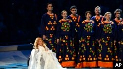 FILE - Yulia Samoylova appears on stage during the opening ceremony of the 2014 Paralympic Games in Sochi, Russia, March 7, 2014.