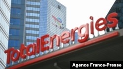 FILE - This May 28, 2021, photo shows the new TotalEnergies logo during its unveiling ceremony, at a charging station in La Defense on the outskirts of Paris.