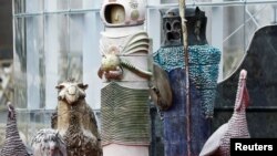 An astronaut figurine stands among the nativity scene display at the Vatican, December 15, 2020. (REUTERS/Guglielmo Mangiapane)