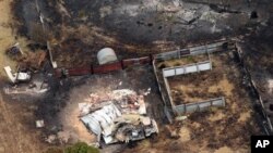 Kebakarn hutan di Tasmania selatan telah menyebabkan sekitar 100 orang hilang dan merusak ratusan bangunan.