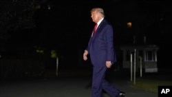President Donald Trump walks on the South Lawn of the White House, Sept. 19, 2020, in Washington, as he returns from a campaign rally in North Carolina. 