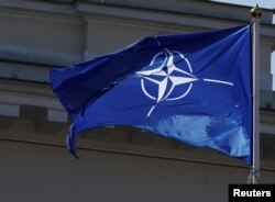 NATO flag flutters during the celebration of the 15th anniversary of Lithuania's membership in NATO in Vilnius, Lithuania, March 30, 2019.