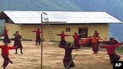 Young monks practicing a dance at the Neyphug Monastery