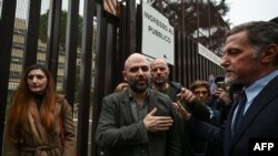 Writer Roberto Saviano (C) leaves the City of Justice in Rome, Nov. 15, 2022,following a hearing in a defamation lawsuit from Italy's current prime minister. 