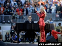 Lady Gaga sings the national anthem before the NFL Super Bowl 50 football game.