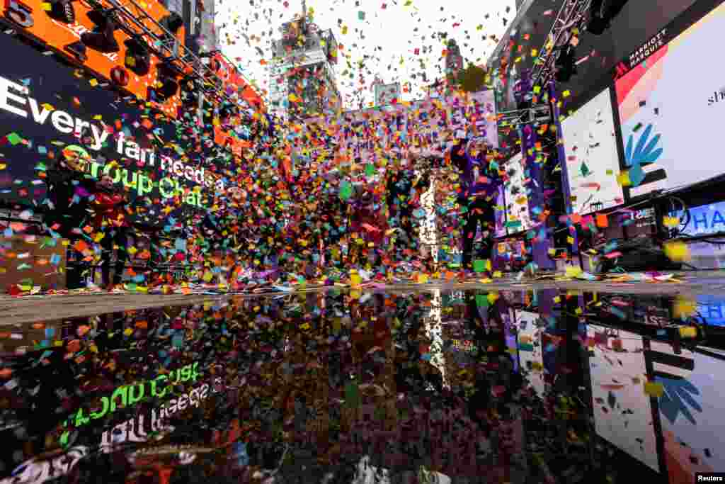 Confetti falls on a platform while organizers of the ball drop on New Year Eve do a confetti test in Times Square, New York.