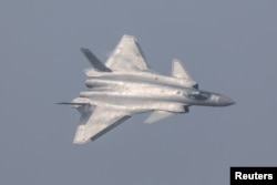 China unveils its J-20 stealth fighter during an air show in Zhuhai, Guangdong Province, China, Nov. 1, 2016.