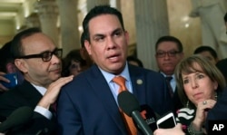 FILE - Rep. Pete Aguilar, D-Calif., speaks with reporters on Capitol Hill in Washington, Jan. 17, 2018.