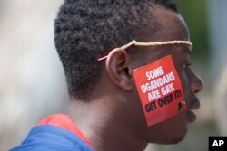 FILE - A Ugandan man is seen during the 3rd Annual Lesbian, Gay, Bisexual and Transgender (LGBT) Pride celebrations in Entebbe, Uganda, Aug. 9, 2014.