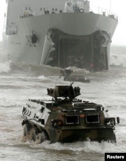 FILE PHOTO - Chinese amphibious armoured vehicles take part in the China-Russia joint military exercise in eastern China's Shandong peninsula, China August 24, 2005.