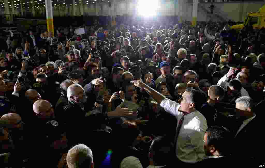 Mitt Romney greets supporters as he campaigns at Integrity Windows, a window factory in Roanoke, Virginia, November 1, 2012.
