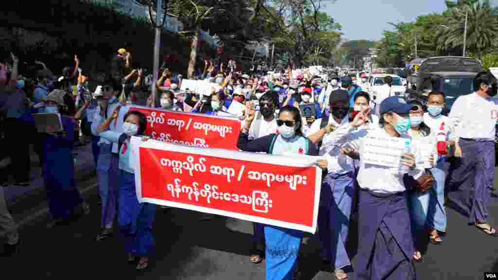 Teachers from universities march in Yangon, Mayanmar, Feb. 9, 2021, to protest against the military coup. (Credit: VOA Burmese Service)