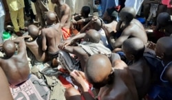 FILE - Men and boys are pictured after being rescued by police in Sabon Garin, Katsina state, Nigeria, Oct. 14, 2019.