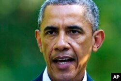 President Barack Obama speaks about Iraq developments while vacationing in Chilmark, Massachusetts, Aug. 11, 2014.