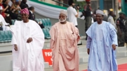FILE- In this Sunday, May. 29, 2011 file photo Former Nigerian Presidents, Ernest Shonekon, left, Gen Abdulsalam Abubukar, centre, Gen Yakubu Gowon, third left arrived for the inauguration ceremony of former Nigeria President Goodluck Jonathan at the eagl