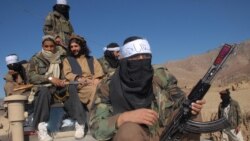 FILE - Pakistan's Taliban commander Latif Mehsud (C), a close aide to the former chief of the Tehreek-e-Taliban Pakistan (TTP), Hakimullah Mehsud, sits on a vehicle in in Khyber Pakhtunkhwa province, Nov. 26, 2008.