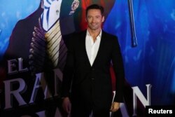 Actor Hugh Jackman poses for photographers on the red carpet for his latest film, a musical directed by Michael Gracey called "The Greatest Showman," in Mexico City, Dec. 13, 2017.